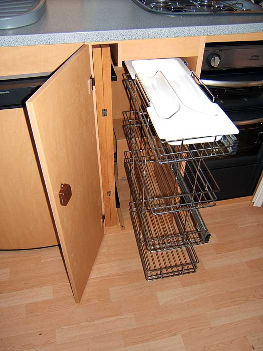Bailey Senator California - This cupboard beneath the worktop pulls out to reveal the cutlery tray and storage baskets.